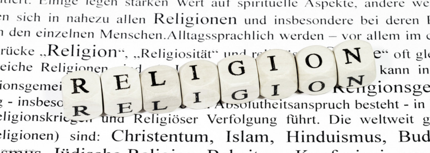 Würfel mit der Aufschrift Religion